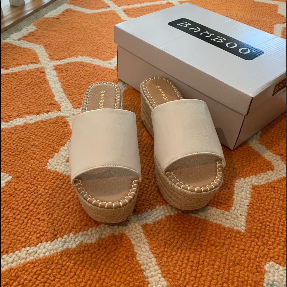 White wedge slides, size 6.5, never worn.